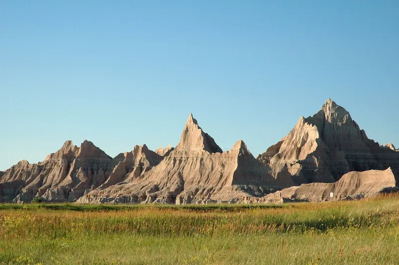 Photo: DimiTalen / CC0, via Wikimedia Commons View of badland formations during golden hour from Cedar Pass Campground, Badlands National Park