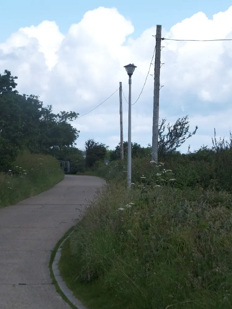 Road to camping site and holiday camp at Thorness